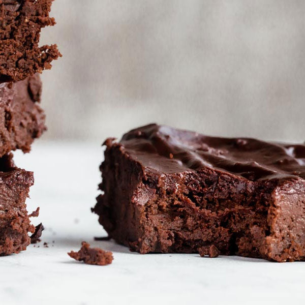 A keto chocolate brownie with a bit taken out of it